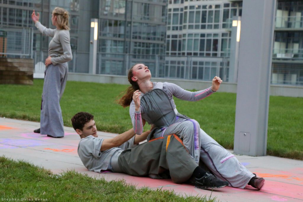Two dancers rehearse together on a CUNY campus.