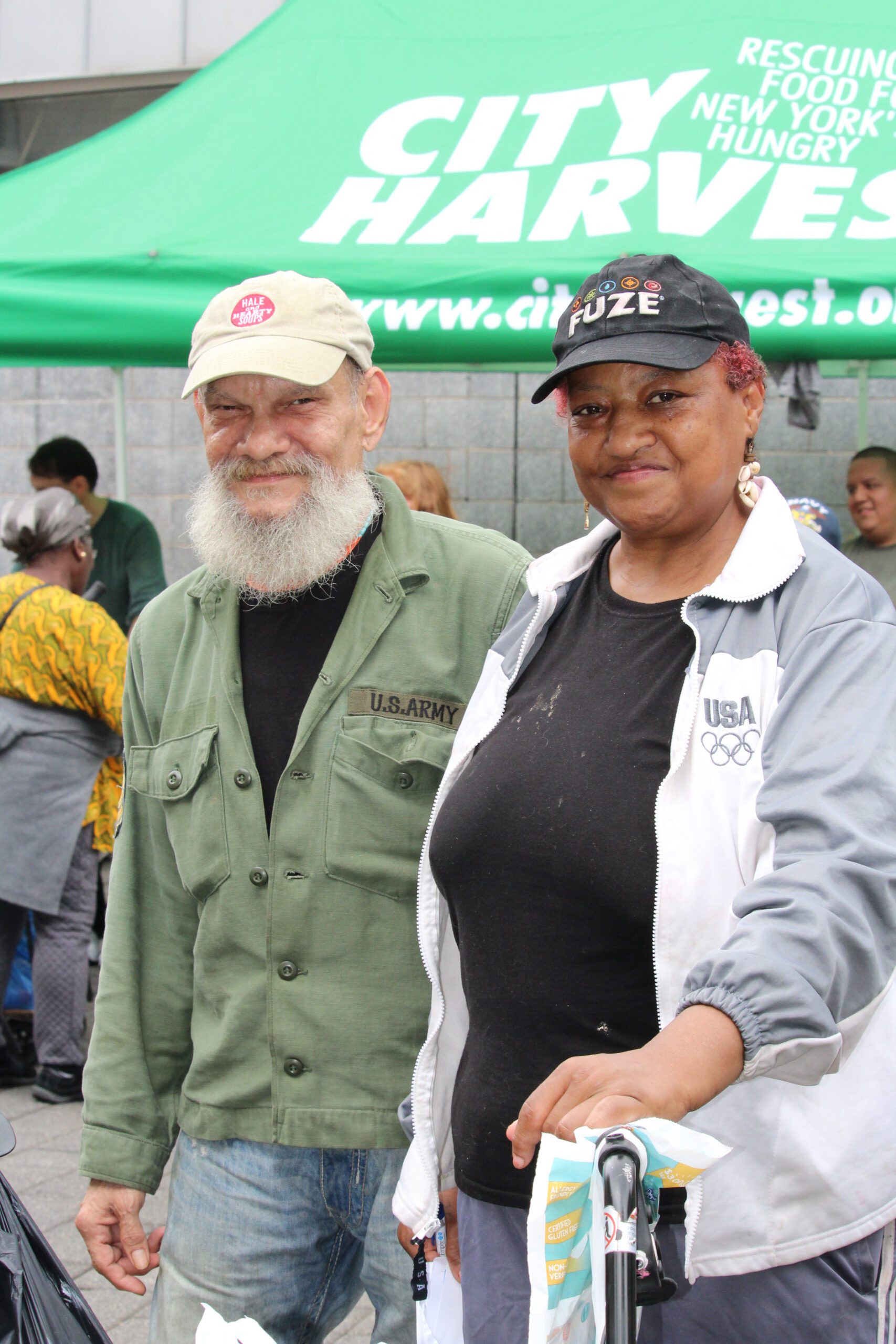 Two people attend a free mobile market in the Bronx.